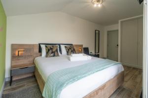 Postel nebo postele na pokoji v ubytování Leevin Guesthouse
