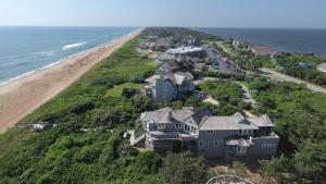 an aerial view of a large house on the beach at OCEANFRONT, Amazing Ocean and Sound Views, Scrnd Porch, PM1, Ariel in Sanderling