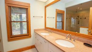 a bathroom with two sinks and a large mirror at OCEANFRONT, Amazing Ocean and Sound Views, Scrnd Porch, PM1, Ariel in Sanderling +41 photos