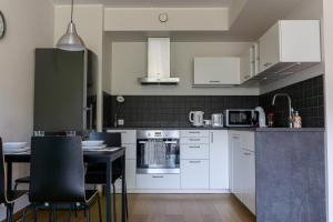 Kuchyň nebo kuchyňský kout v ubytování Vibu Apartment