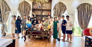 a group of people posing for a picture in a room at Rose Homestay in Ninh Binh