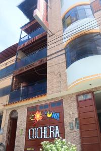 a store front of a building with a sign on it at HOSTAL SOL & LUNA in Huánuco