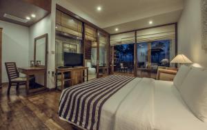 Postel nebo postele na pokoji v ubytování Suriya Resort