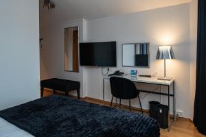 TV a/nebo společenská místnost v ubytování Quality Hotel Statt