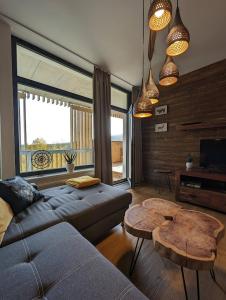 Posezení v ubytování Zadov - Apartmán Srdce Šumavy + 30 fotografií