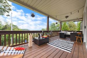a deck with a pergola with a table and chairs at The Cielo - Ohio River Views in the City in Pittsburgh