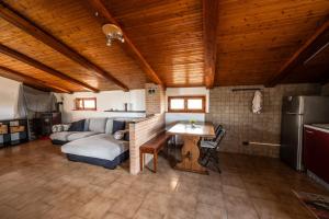 a living room with a couch and a table at L'Oasi di Ramona in Polesine Parmense