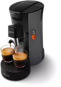 una macchinetta del caffè con una tazza di caffè di Zentrale Wohnung für 4 mit Bett und Schlafcouch a Essen