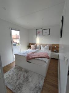 Postel nebo postele na pokoji v ubytování Deluxe Apartman Lara