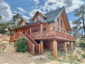 a large wooden house with a large deck at Hilltop Chalet-Stunning Views, 3mi from downtown in Prescott