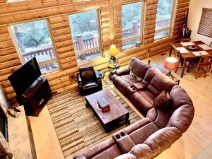 an overhead view of a living room with a leather couch at Hilltop Chalet-Stunning Views, 3mi from downtown in Prescott