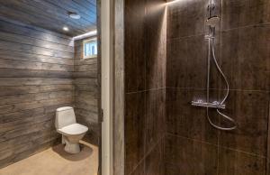 a bathroom with a shower and a toilet in it at Yurt District in Rovaniemi