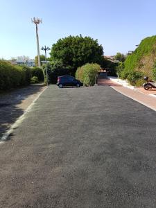 a car parked on the side of a road at Royal Playa Suite and Apartament -private parking- self chek out in Catania