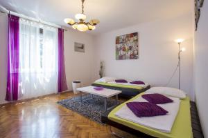En eller flere senger på et rom på Apartments Cosy and Comfortably