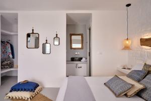 Postel nebo postele na pokoji v ubytování Casa Tagoo Mykonos