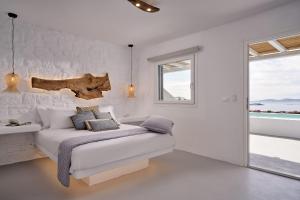 Postel nebo postele na pokoji v ubytování Casa Tagoo Mykonos