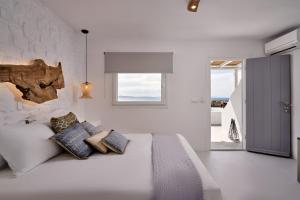 Postel nebo postele na pokoji v ubytování Casa Tagoo Mykonos