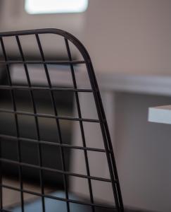 a black metal stair railing in a room at Masticha Apartment in Oinófita