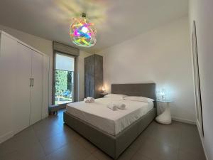Posteľ alebo postele v izbe v ubytovaní Vivaldi Home - Immobili e Soluzioni Rent