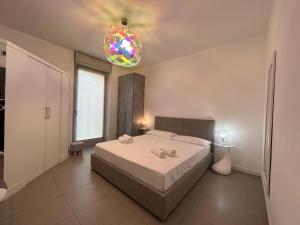 Posteľ alebo postele v izbe v ubytovaní Vivaldi Home - Immobili e Soluzioni Rent
