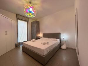 Posteľ alebo postele v izbe v ubytovaní Vivaldi Home - Immobili e Soluzioni Rent