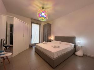 Posteľ alebo postele v izbe v ubytovaní Vivaldi Home - Immobili e Soluzioni Rent