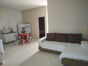 a living room with a couch and a table at Casa mobiliada de 2 quartos na R Oliveira Alves Fontes, 609 E 603 - Jardim Gonzaga in Juazeiro do Norte +21 photos