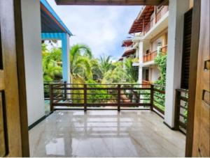 a balcony with a view of a building at Villa Four Seasons in Mirissa