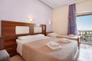 A bed or beds in a room at Zante View Studios & Villas Még 37 kép