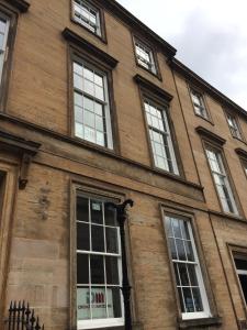 a building with many windows on the side of it at Dreamhouse at Blythswood Apartments Glasgow in Glasgow