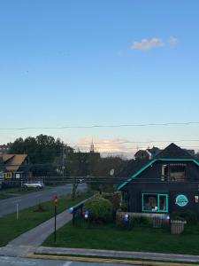 a house on the side of a road with a street at Hotel Boutique Casa&Alma in Puerto Varas +15 photos