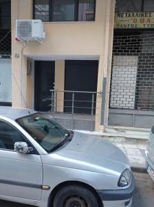 a silver car parked in front of a building at Minimal Two-Floor Apartment in Thessaloniki