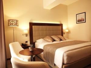 
A bed or beds in a room at Grand Hotel Portoroz 4* superior – Terme & Wellness LifeClass
