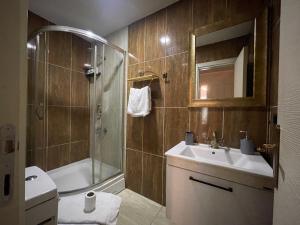a bathroom with a sink and a shower and a toilet at Es Moda in Istanbul +88 photos