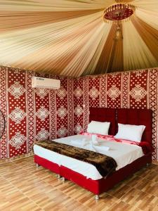 Postel nebo postele na pokoji v ubytování sand magic camp
