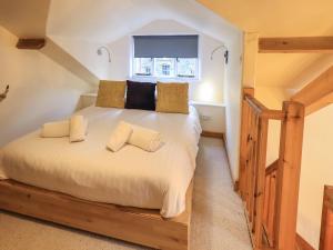 Postel nebo postele na pokoji v ubytování Jane's Cottage