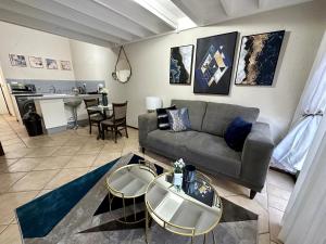 a living room with a couch and a table at Luxurious Condo in Fourways - A Hotel Experience with a Personal Touch in Sandton +29 photos