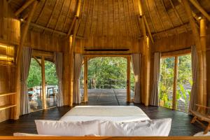 Postel nebo postele na pokoji v ubytování Jungleight Bali
