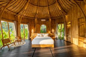 Postel nebo postele na pokoji v ubytování Jungleight Bali