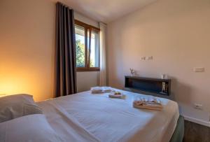Postel nebo postele na pokoji v ubytování Appartamento Villa Martinoni + 17 fotografií