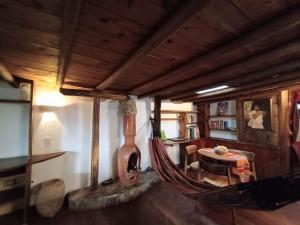 a living room with a hammock in a house at Hobbit House in Envigado