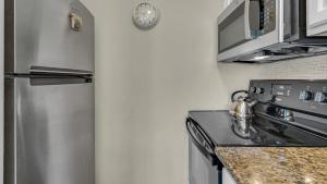 Kuchyň nebo kuchyňský kout v ubytování Sandpiper Cove 8120