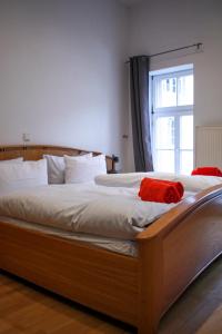 a bedroom with a wooden bed with a window at Domhotel in Sankt Wendel
