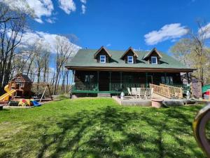 a large house with a green roof on a yard at 4 bedroom 4parking can cook Fireplace,Office in Ottawa