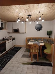 a kitchen with a table and a dining room at Lillas Ferien Wohnung in Teufenbach