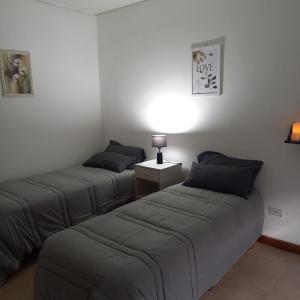 En eller flere senge i et værelse på SOUL USHUAIA