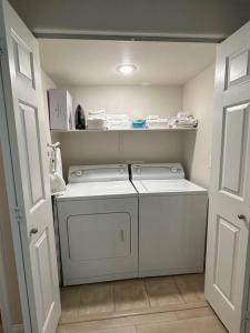 a small laundry room with a washer and dryer at Mesquite Retreat 2 Bd Condo by Cool Properties LLC in Mesquite