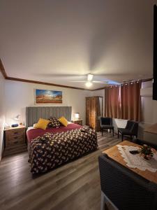 a bedroom with a bed and a table with chairs at Brooklyn Motel in Brooklyn