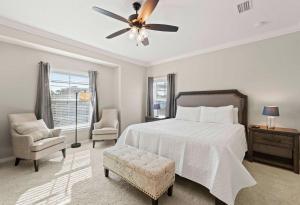 a bedroom with a bed and a ceiling fan at Paradise Key at Lost Key Golf & Beach Club in Pensacola +44 photos