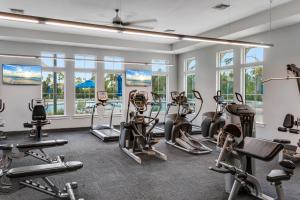 a fitness room with treadmills and cardio machines at Paradise Key at Lost Key Golf & Beach Club in Pensacola